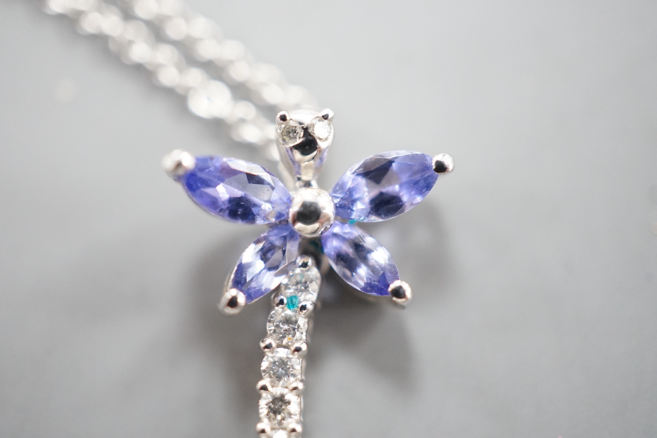 A modern Italian 18ct white gold, tanzanite? and diamond set dragonfly pendant necklace, pendant, 18mm, chain 43cm, gross weight 3.3 grams.